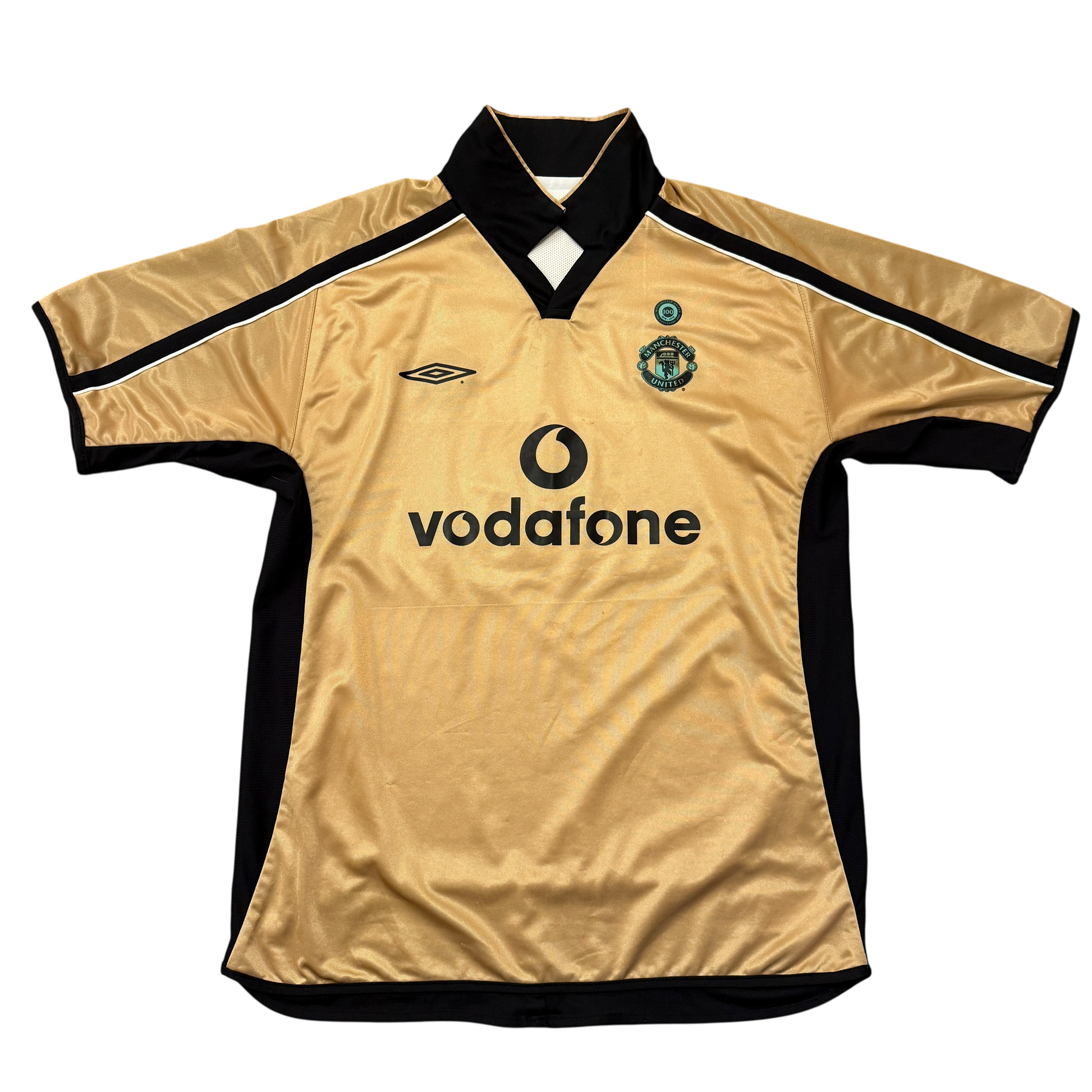 Gold side of the Manchester United 2001-2002 Third jersey with black accents and Vodafone logo on a white background