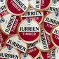 Jurrien Timber sticker featuring a design inspired by an Amstel beer label, with bold red and gold tones and a creative unofficial Arsenal-themed style.