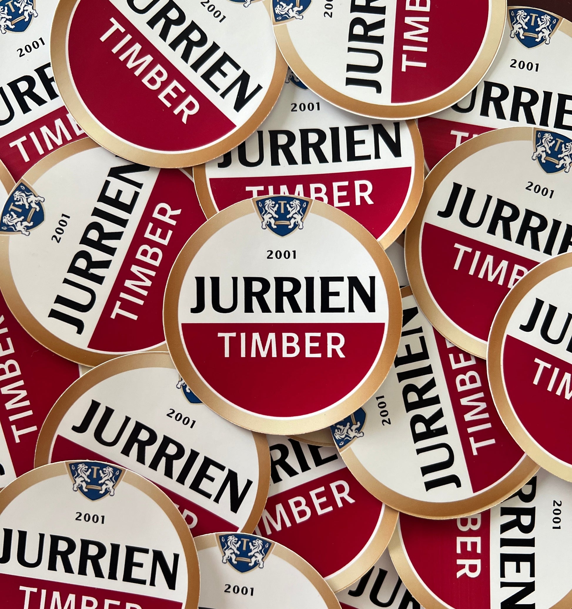 Jurrien Timber sticker featuring a design inspired by an Amstel beer label, with bold red and gold tones and a creative unofficial Arsenal-themed style.