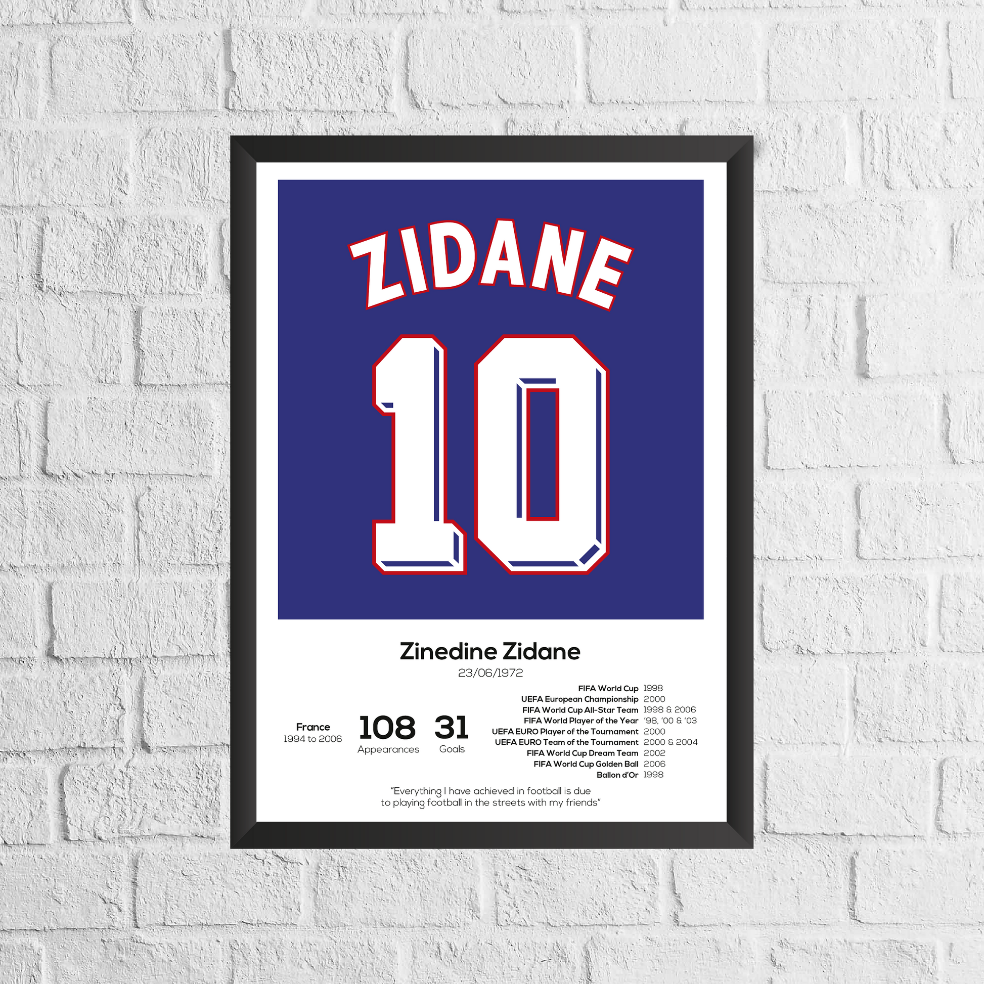 Framed poster of Zinedine Zidane with number 10 on a white brick wall