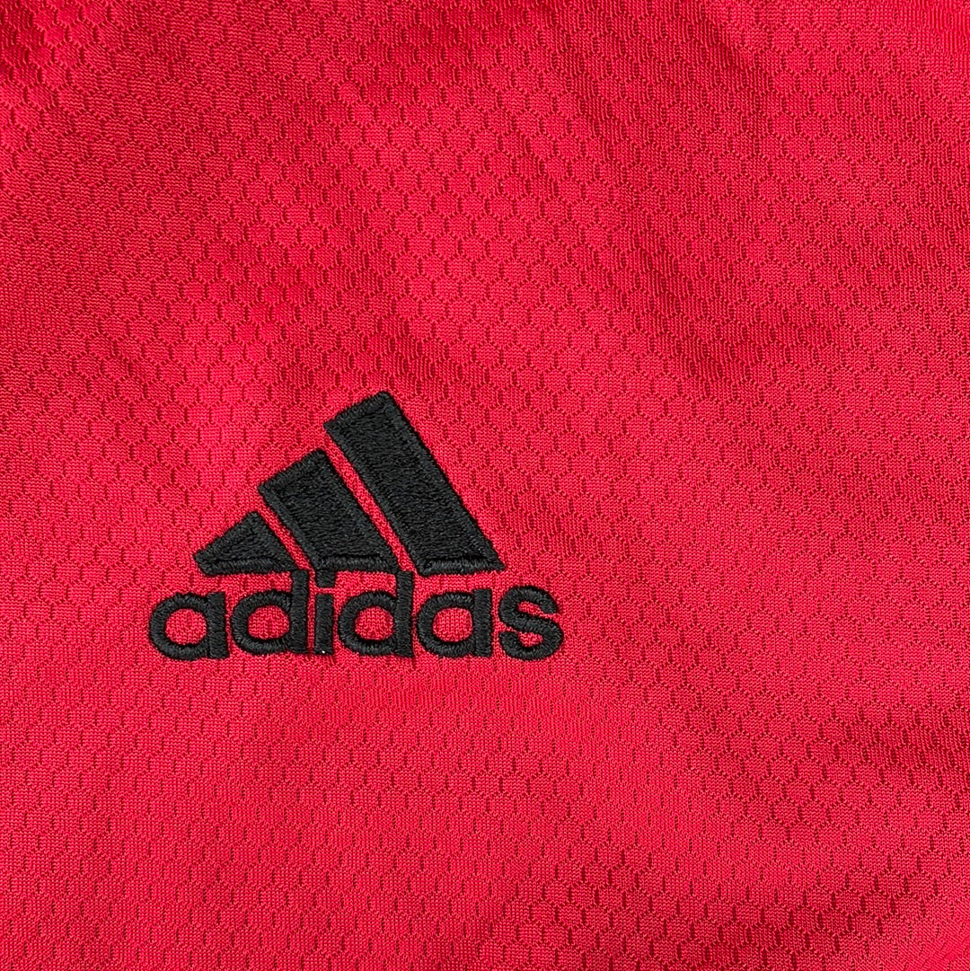 Black embroidered Adidas badge