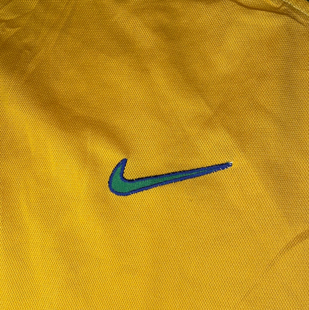 Green and blue outlined Nike swoosh